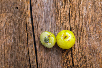 Fresh Indian gooseberry over wooden background 
