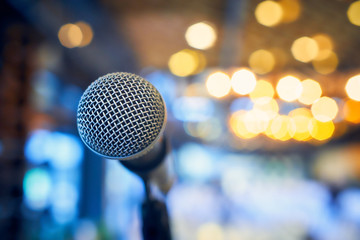 Close-up of a microphone on a background of blurred lights