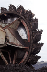 A huge bucket-wheel excavator digging coal on the open-pit mine.