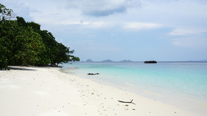 Fototapeta na wymiar Beautiful beach with blue sea background outdoor