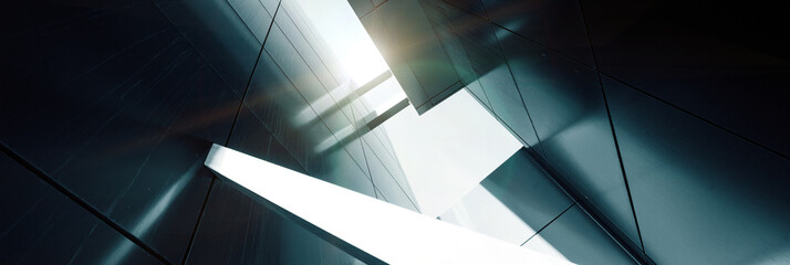 Fototapeta premium Szeroki kąt abstrakcyjny widok tła stalowego jasnoniebieskiego wieżowca wysokiego wzrostu handlowego wykonanego ze szkła na zewnątrz. koncepcja udanej architektury przemysłowej i budynku centrum biurowego