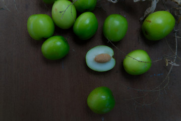 Jujube seed with wood background. Top view fruits.