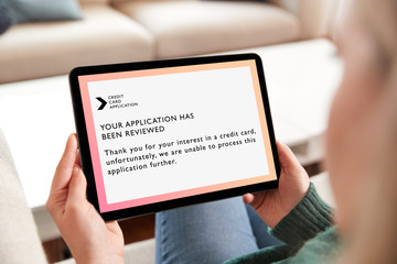 Close Up Of Woman Being Rejected For Credit Card Online Using Digital Tablet At Home