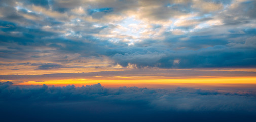 Blanket of clouds. Sun going below a blanket of clouds. On top of a blanket of clouds. Sun going below a blanket of clouds. Smooth view from above with a blanket of clouds.