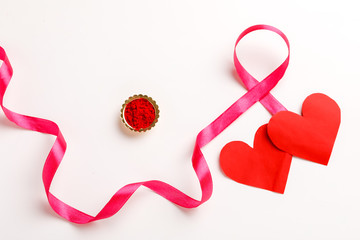 Pink ribbon for breast cancer awareness, symbolic bow color raising awareness on people living with...