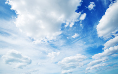 white fluffy clouds on blue sky in summer