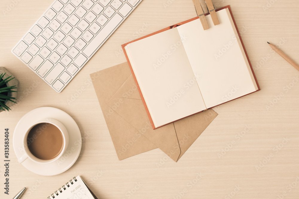Poster modern desk business working place with glasses,keyboard,pen and notebook on table workspace top vie