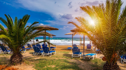 View of sunbeds awaiting tourists at the Greek island resort of Georgioupolis on Crete north coast....