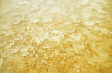 golden texture and tracing paper as a background