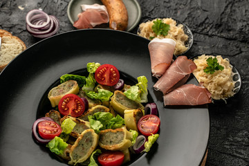 delicious German traditional specialties, Tyrolean ham, maultaschen, sauerkraut, fresh slices of baguette