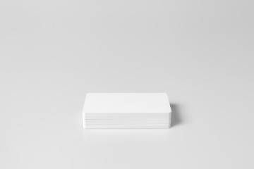 Stack of  white blank credit cards mockup on white background.
