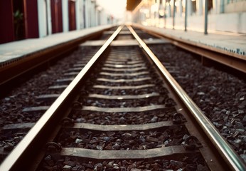 Obraz premium The railroad was empty without passengers after the train had left the station in the evening.