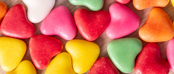 Valentines Day background with hearts shaped on a wooden table