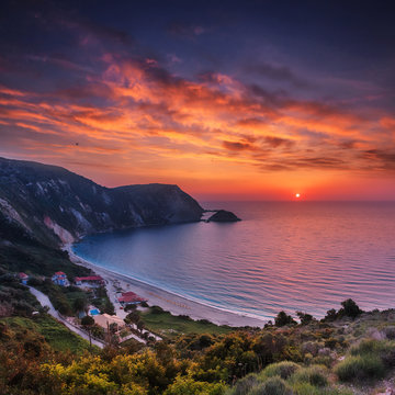 Incredible view of Petani Beach during sunset. Fantastic sunset on Cephalonia Island, Greece, Europe. Impressive evening seascape of Mediterranen Sea. Wonderful nature scene of Ionian sea. postcard.