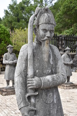 Fototapeta na wymiar Statue of Vietnamese Soldier with Sword, Portrait, Tomb of Khai Dinh