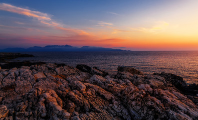 Splendid colorful seascape during sunset. Incredible nature Landscape. Amazing beach sunset with Picturesque sky. Unsurpassed sunrise over the Ionian Sea. Scenic nature sunset above sea. Greece