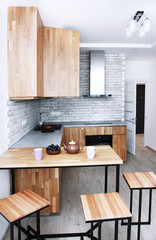 Scandinavian kitchen design, oak furniture, home breakfast, morning view, interior for two,...