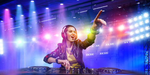 Female dj in nightclub. Mixed media