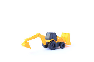 Obraz na płótnie Canvas The yellow toy car Bulldozer-Excavator isolated on white background. Children's backhoe toy model.