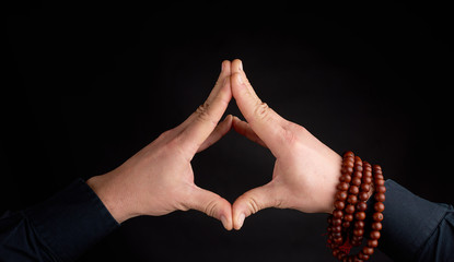 two male hands connected on a black background