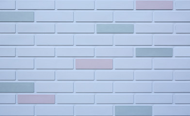 Background of white brick wall with some different color.