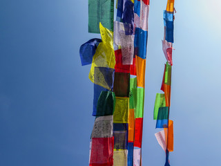 Coloured praying flags hanging at Bouddhanath temple in Kathmandu, Nepal
