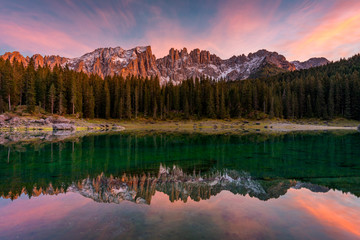 Carezza lake (Lago di Carezza, Karersee) with Mount Latemar, Bolzano province, South tyrol, Italy. Landscape of Lake Carezza or Karersee and Dolomites in background, Nova Levante, Bolzano, Italy.