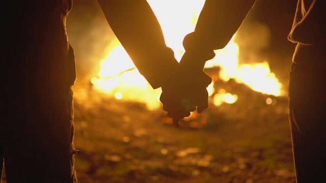 Family couple supporting each other after home destroyed by war fire, Ukraine 