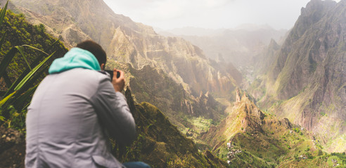Fototapeta na wymiar Santo Antao Island, Cape Verde. Travel hiker photographing unique surreal amazing Xo Xo valley and mountain cliffs