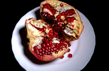 ripe pomegranate broken into pieces