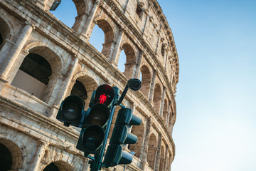 A red traffic light in front of the Colosseum, Rome