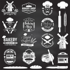 Fototapeta premium Set of Bakery shop badge on the chalkboard. Concept for badge, shirt, label, stamp. Design with windmill, rolling pin, dough, wheat ears silhouette. For restaurant identity, packaging menu