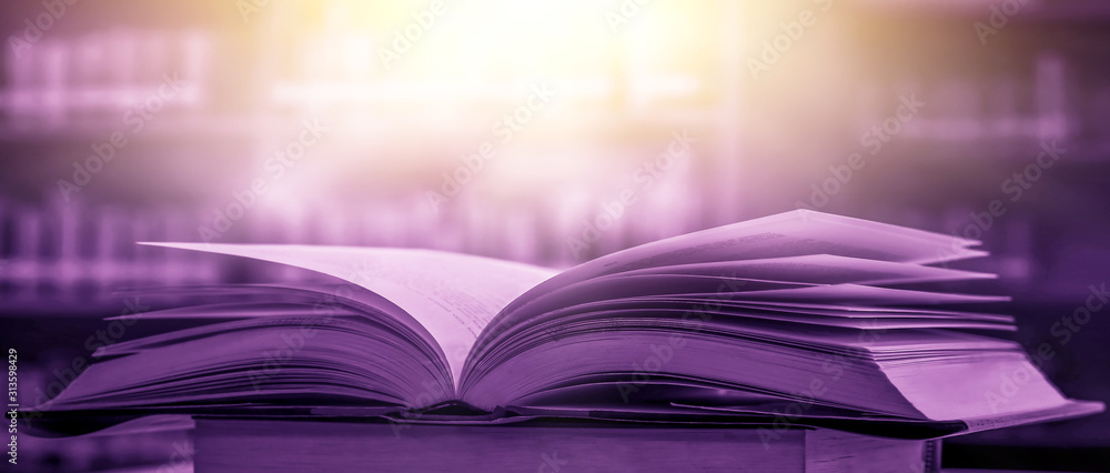 Poster stack of books in the library and blur bookshelf background