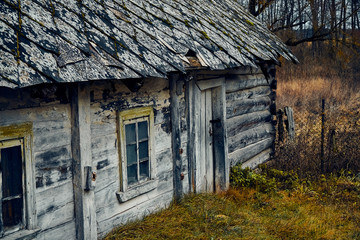 Fototapeta na wymiar A terrible mysterious apocalyptic view: an abandoned house in the abandoned Belarusian Kovali (Belarusian: blacksmiths) village - no one lives here anymore