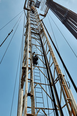 Drilling rig against the blue sky