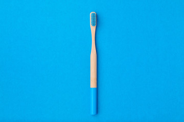Toothbrush on blue background top view