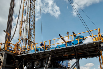 Drilling rig against the blue sky