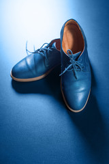Blue men's leather shoes on dark background - 313601698