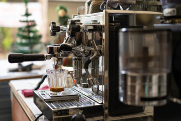 Barista Making Espresso with Coffee Machine