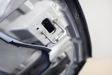 details of car engine, hood or bonnet, the hinged cover over the engine of motor vehicles, shallow depth of field