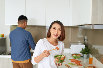 Young couple spending morning time together in their kitchen at home