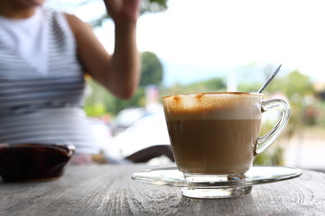 hot latte coffee put on wooden table in cafe restaurant, breakfast in morning day