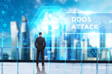 Business, Technology, Internet and network concept. Young businessman working on a virtual screen of the future and sees the inscription: Ddos attack