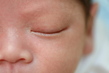 close up eye of cute newborn baby sleeping sweet dream