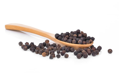 black pepper , spoon on white background