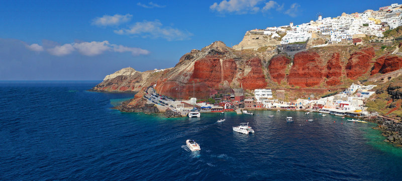 Aerial drone ultra wide photo of small picturesque harbour of Ammoudi below iconic village of Oia, Santorini island, Cyclades, Greeceaegean, aerial, ammoudi, amoudi, amoudi bay, architecture, bay, bea