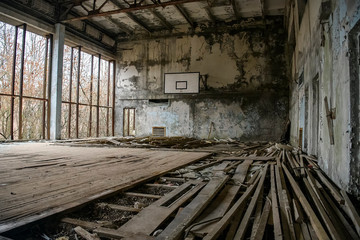 Fototapeta na wymiar Abandoned Gym in ghost town Prypiat in Chornobyl exclusion zone. Pripyat, Ukraine, December 2019