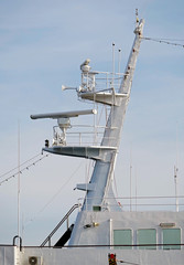 Ships antenna and navigation system on background sky