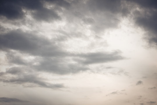Evening sky with floating white clouds at sunset. The background.