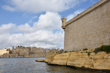 Fort St Angelo (Forti Sant Anglu), located at Birgu Waterfront, Malta, Vittoriosa bay of the Mediterranean sea, Valletta town is in background - 313608861